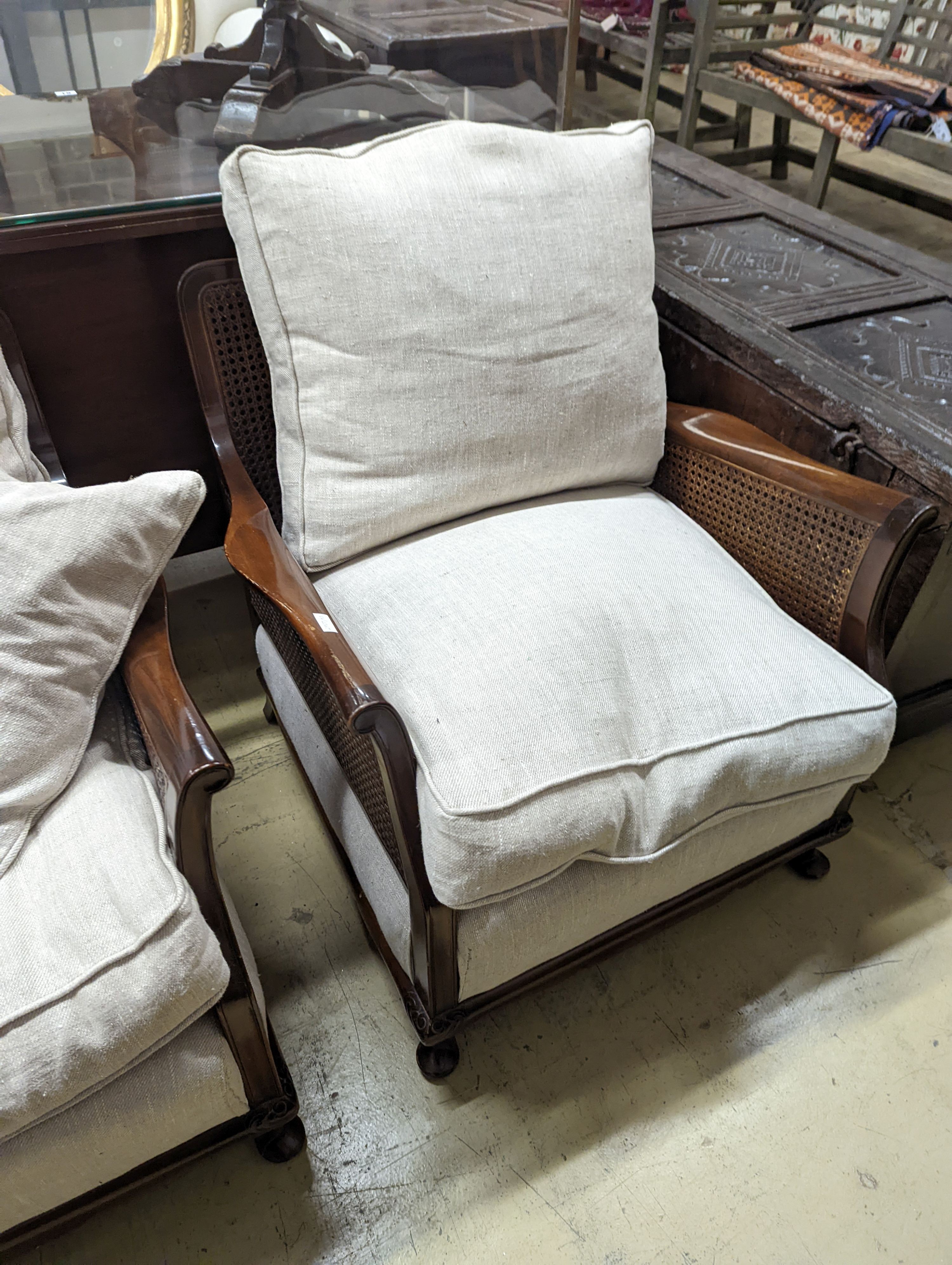 An early 20th century caned Bergere mahogany three piece suite, settee length 164cm, depth 70cm, height 70cm